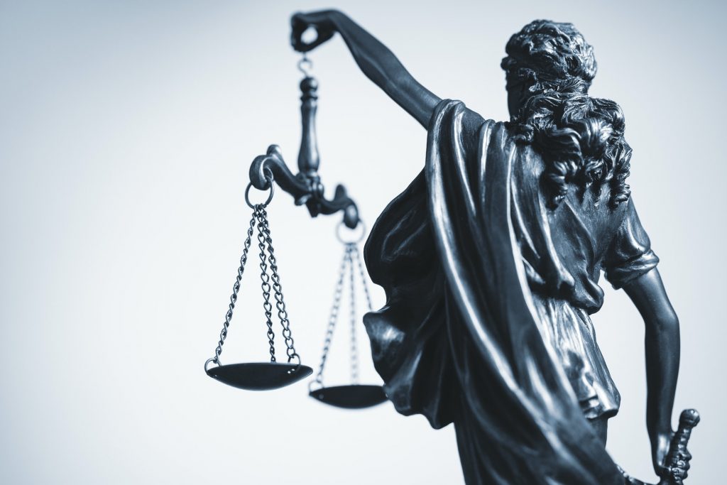 Cropped view of statue of Justice with the scales